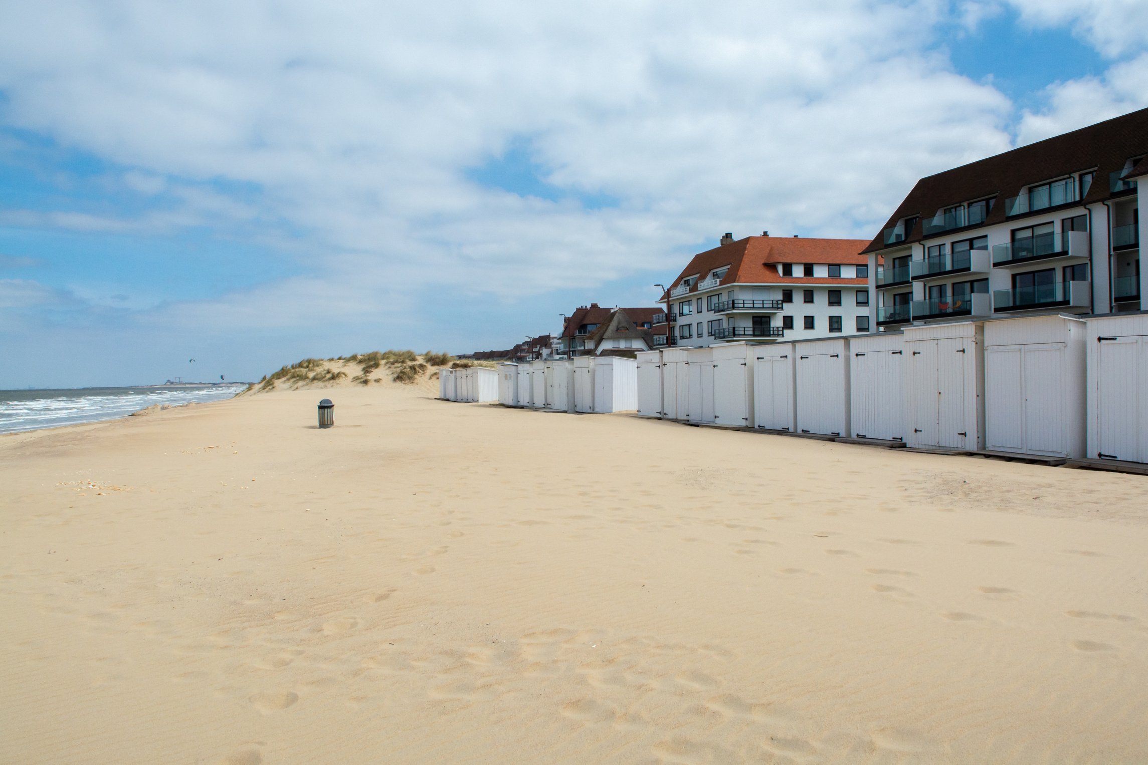 Yellow sandy beach in small Belgian town Knokke-Heist, luxury vacation destination, summer holidays